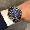 ساعه من tissot تعمل بعدادات بلون اسود & ازرق وسير فضي من المعدن