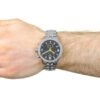 ساعه من tissot تعمل بعدادات بلون اسود وسير فضى من المعدن