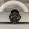 ساعة من Roger Dubuis تعمل بعدادات بلون دهبي وسير اسود من الجلد الطبيعى